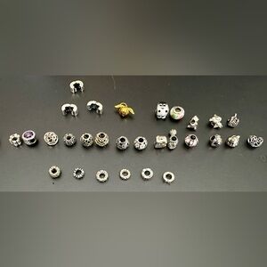 29 Authentic retired Pandora charms - like new.